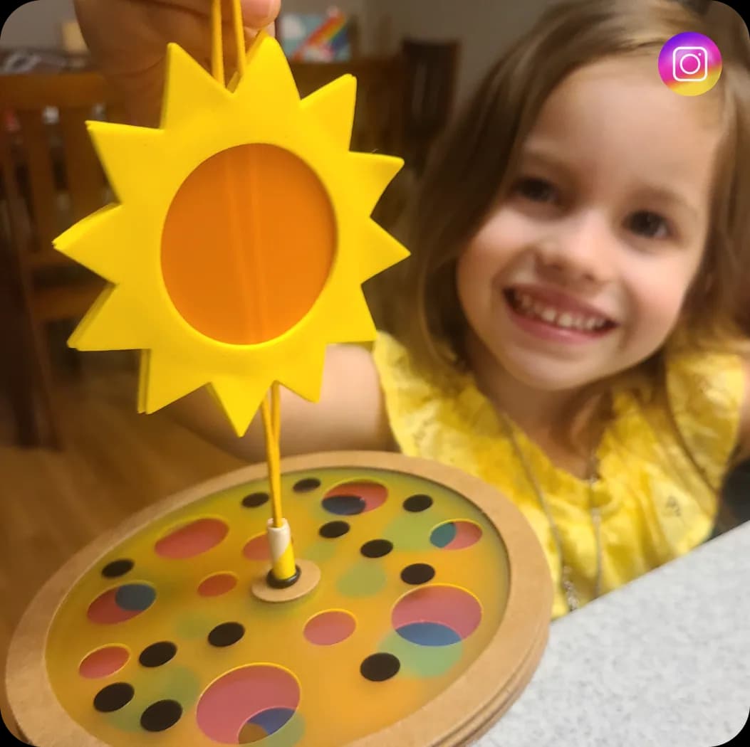 A girl behind a MEandMine sun spinner