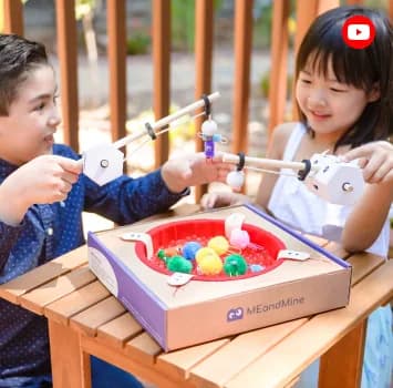 Children playing a game on a MEandMine box