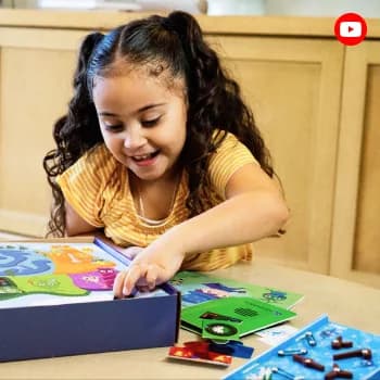 A girl building a MEandMine kit at the table