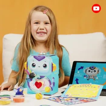 A girl holding the robot from a Robot Circuits kit