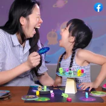 A woman and a girl playing a MEandMine game