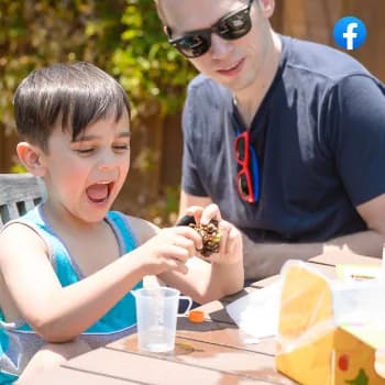 A boy and a man doing an experiment