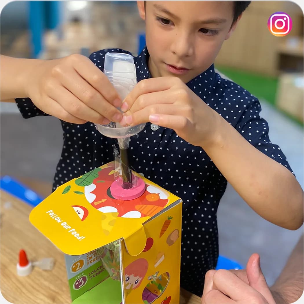 A boy filling a MEandMine science kit