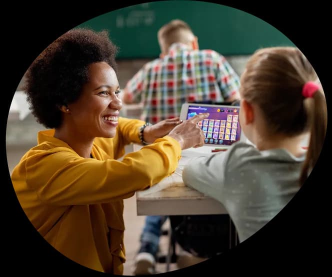 A teacher helping a student in class
