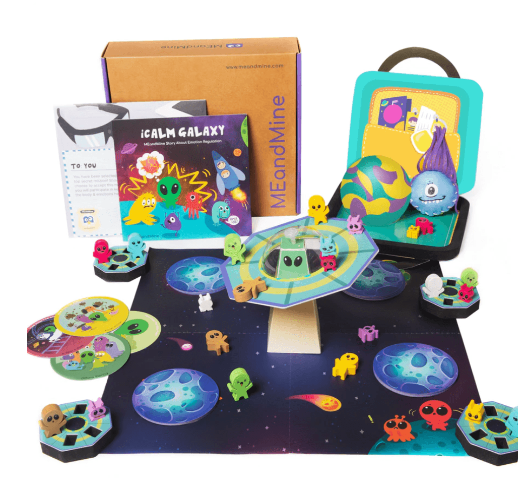 MEandMine iCalm Galaxy kit: storybook, space board game with alien figures, flying saucer piece and a calm-down case.