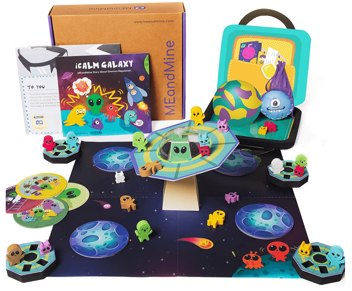MEandMine iCalm Galaxy kit: storybook, space board game with alien figures, flying saucer piece and a calm-down case.