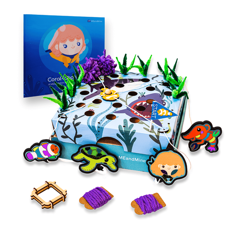 MEandMine ocean adventure kit: a storybook, a shark-themed lacing board with pipe cleaner seaweed and sea animal figures.