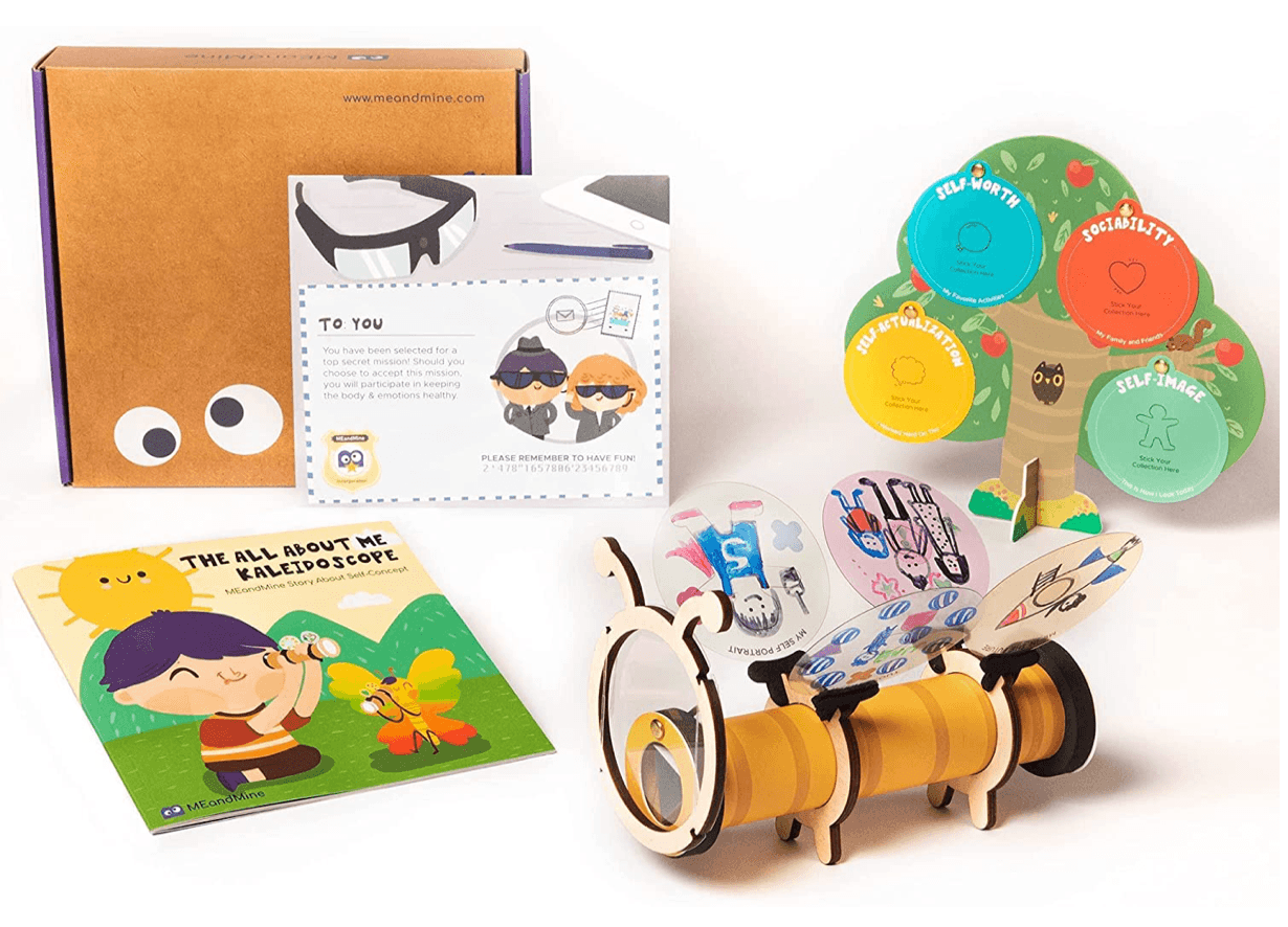 MEandMine All About Me Kaleidoscope kit: storybook, wooden bee kaleidoscope with drawn slides, and a self-concept tree.