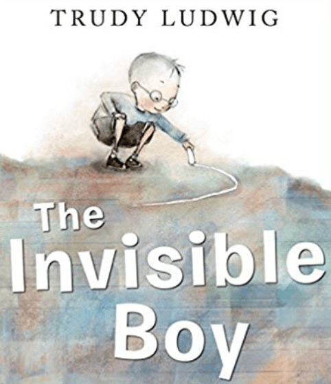 Cover of the children's book The Invisible Boy by Trudy Ludwig, with a boy in glasses drawing a chalk heart