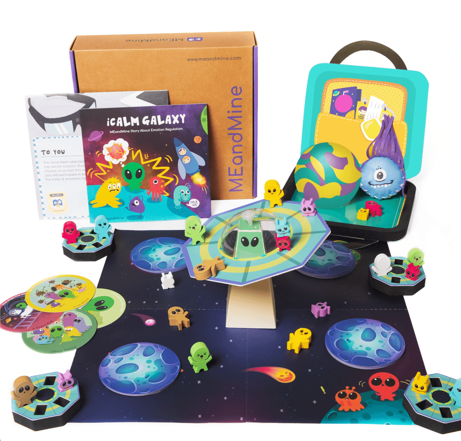 MEandMine iCalm Galaxy kit: storybook, space board game with alien figures, flying saucer piece and a calm-down case.
